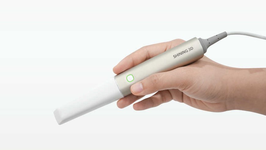 An intraoral scanner recording a digital model of the teeth.